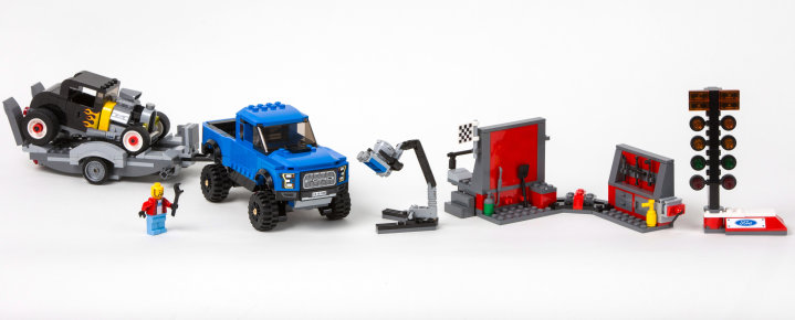 The 664-piece LEGO F-150 Raptor set includes a well-equipped garage, trailer, a drag racing Christmas tree and Model A hot rod, plus a crew of Ford workers. The set will be available for purchase on March 1.
