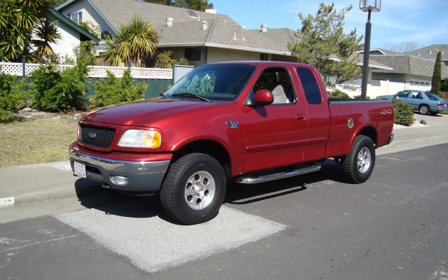 Red 2000 Ford F-150 4×4 in the Garage