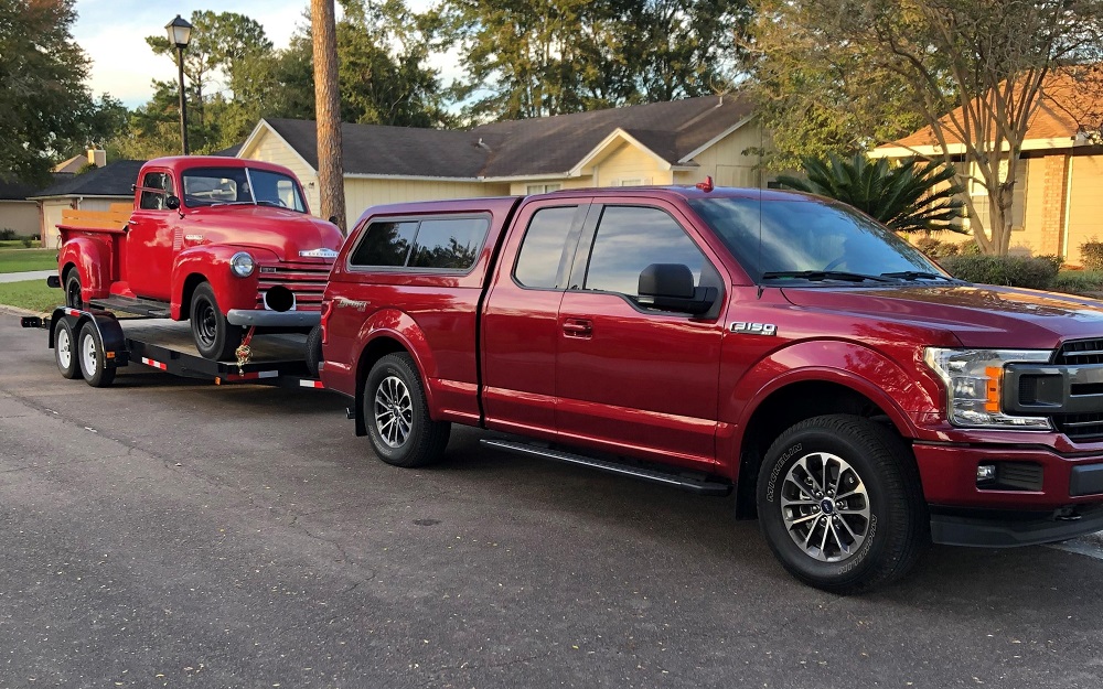 Ford F-150 Towing Chevy Truck
