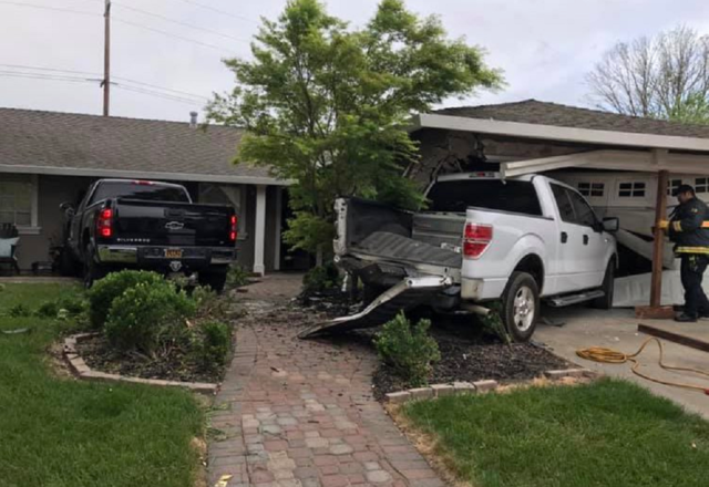 F-150 and Chevy Silverado crash into home