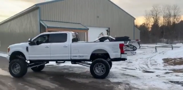 f150online.com Super Duty with Air Suspension Makes Loading a Snowmobile Easy