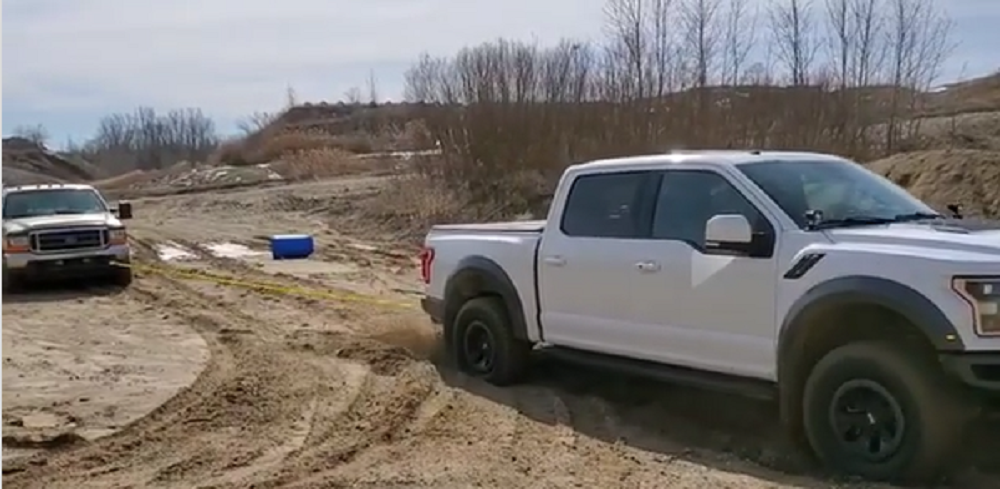 f150online.com F-150 Raptor Helps Fellow Ford Truck Get Out of Sticky Situation