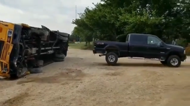 f150online.com Ford Super Duty Yanks a School Bus Back Onto All Four Wheels