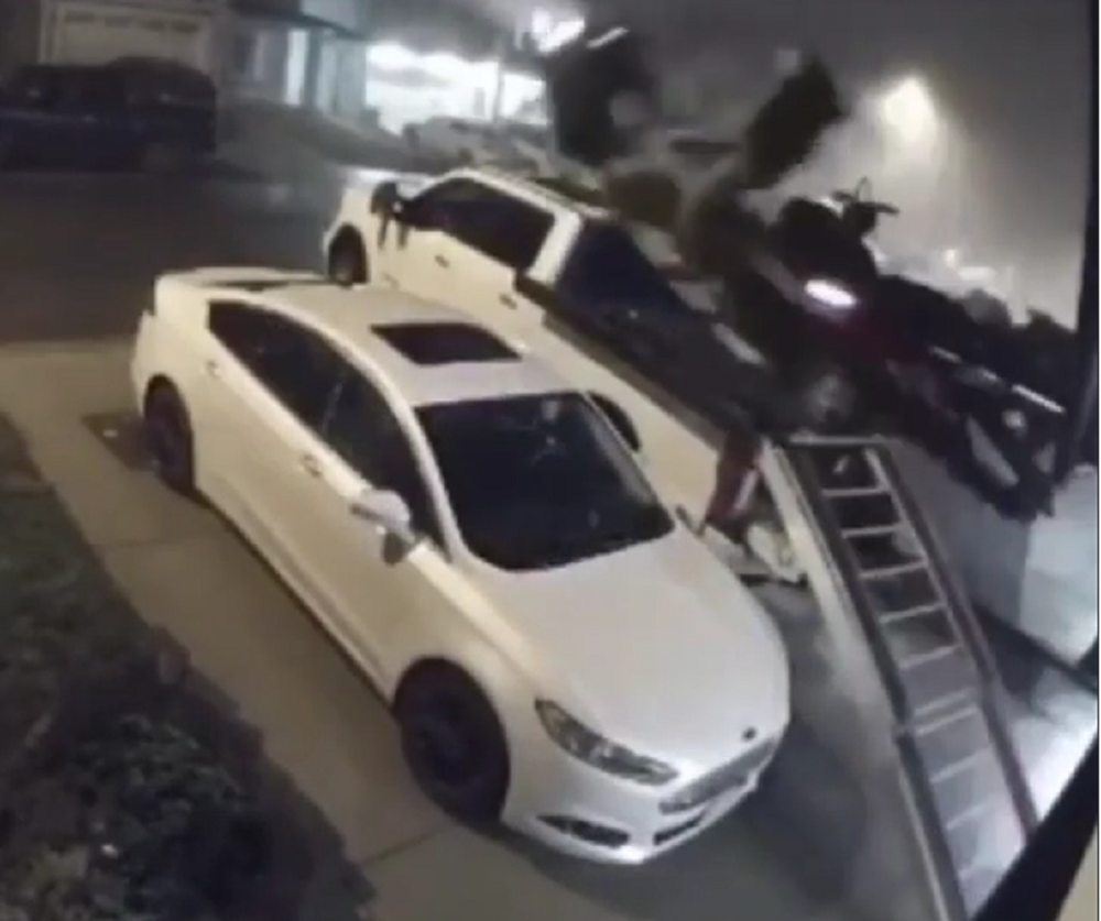 f150online.com Poor Guy Bounces Snowmobile Off the Roof of His Super Duty